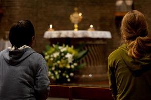 Young people pray for the synod on young people, faith and vocational discernment during Eucharistic adoration at the Centro San Lorenzo in Rome on Oct. 11, 2018.


