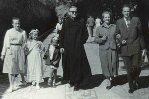 Father Karol Wojtyla (c) at Catherine Poltawska’s first Communion on June 21, 1959. Her mother, Wanda, is on the far left, younger sister Ania is beside Father Wojtyła, and Andrzej Poltawski is at the right with his mother.