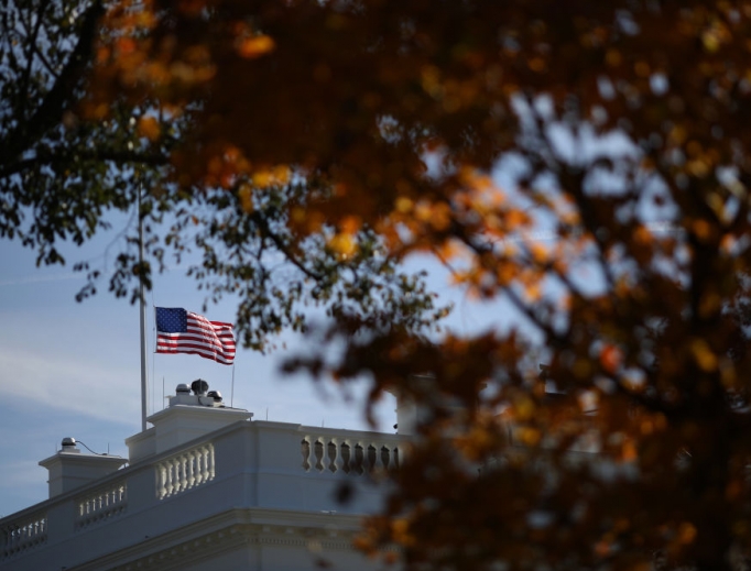 The American flag over the White House flies at half staff Nov. 8 following the shooting in Thousand Oaks, California, late Wednesday evening. A gunman fatally shot 12 people at a country-and-western dance hall. 