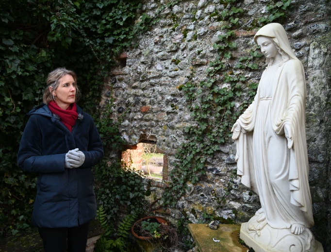 Above, poet and Catholic covert Sally Read prays among the ruins of the Franciscan friary at England’s chief Marian shrine in Walsingham, England. Below, Read and her daughter, Flo, pray before the Our Lady of Walsingham statue in the Slipper Chapel at Walsingham.