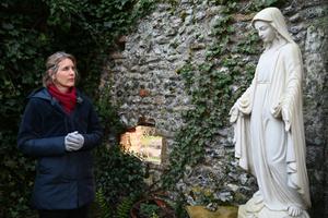 Above, poet and Catholic covert Sally Read prays among the ruins of the Franciscan friary at England’s chief Marian shrine in Walsingham, England. Below, Read and her daughter, Flo, pray before the Our Lady of Walsingham statue in the Slipper Chapel at Walsingham.