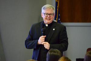 Msgr. Stuart Swetland, president of Donnelly College in Kansas City, Kansas, encourages students to seek God amid their studies. 