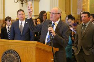 Dr. Tom Perille, President of Colorado's chapter of Democrats for Life displays a model of a seven month old unborn baby at the Colorado State Capitol on February 11, 2020. 