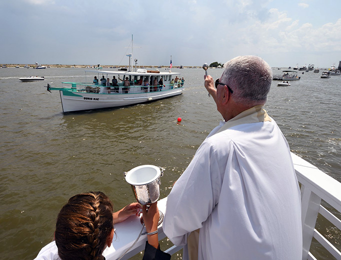 Fr. Greg Barras blesses a boat