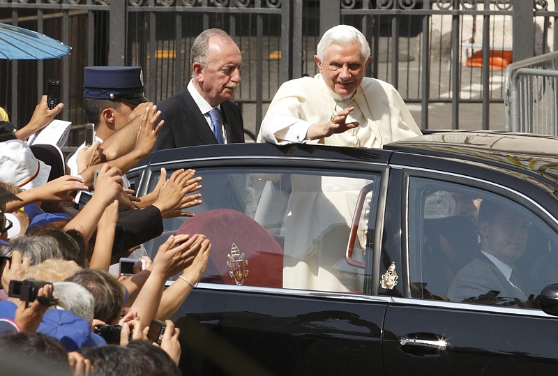 Pope Benedict XVI arrives in an open car to bless a statue of St. Annibale Di Francia before his general audience at the Vatican July 7. The 18-foot statue is in a niche on an exterior wall of St. Peter's Basilica.