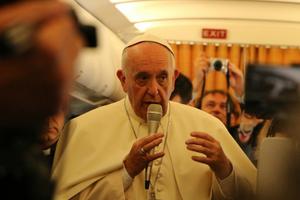 Pope Francis speaks to journalists on the papal flight from Rome to Armenia on June 24, 2016.