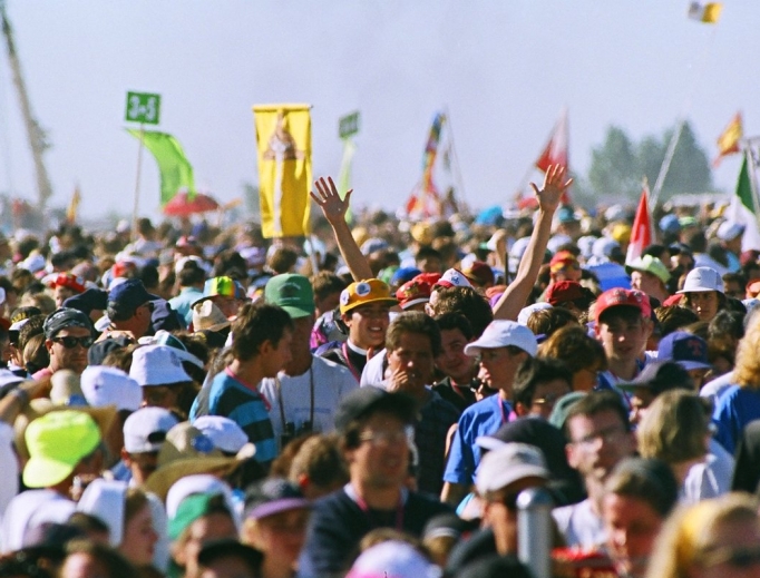 An estimated 750,000 youth descended on Cherry Creek State Park in August 1993, as shown in archival photos that include Pope St. John Paul II celebrating the closing Mass. The 25th anniversary was celebrated Aug. 11 in Denver (below). Archbishop Samuel Aquila is showing celebrating the anniversary Mass with priests from the Archdiocese of Denver.