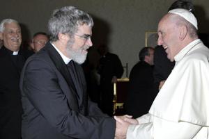 Jesuit Brother Guy Consolmagno greets Pope Francis.