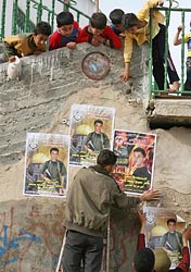 Posters portraying an 18-year-old Palestinian suicide bomber as a martyr.