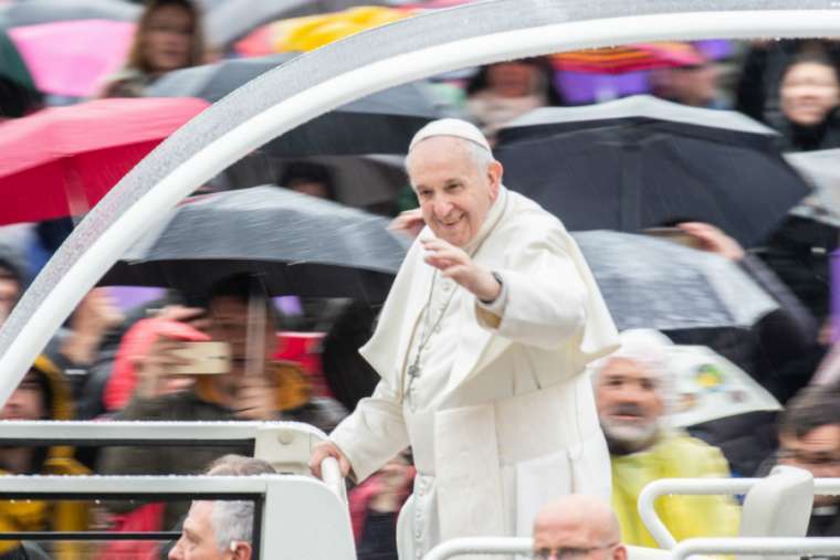 Pope Francis waves at the general audience, April 10, 2019. 