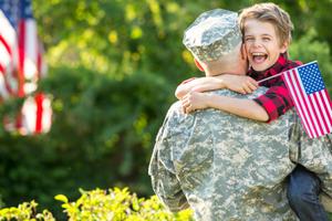Father surprises son coming home from war. 