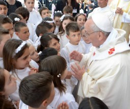 Pope Francis meets with first Communicants May 26 at Sts. Elizabeth and Zechariah parish in Rome.