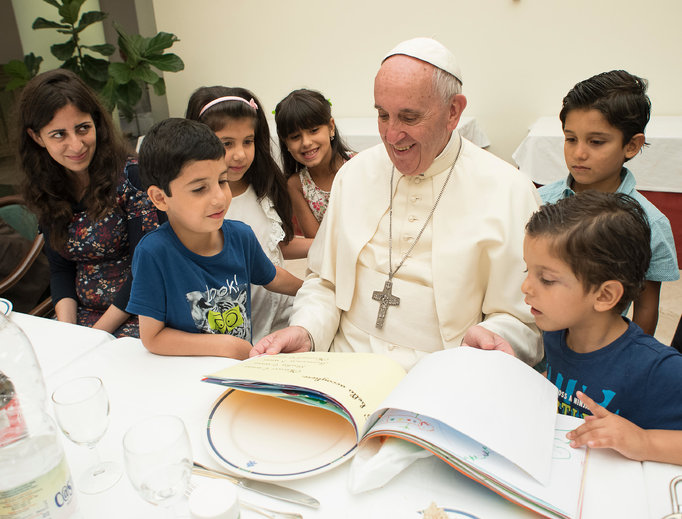 Pope Francis hosts a lunch with Syrian refugees at his residence in Vatican City on Aug. 11.
