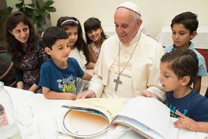 Pope Francis hosts a lunch with Syrian refugees at his residence in Vatican City on Aug. 11.

