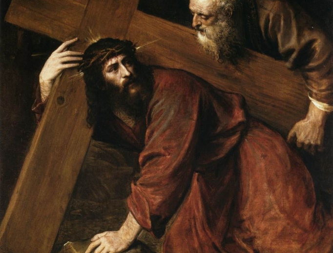 Simon helps Jesus carry the cross.