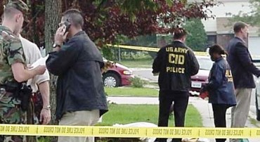 Investigators at the crime scene in Wichita, Kan., where late-term abortionist George Tiller was murdered May 31.