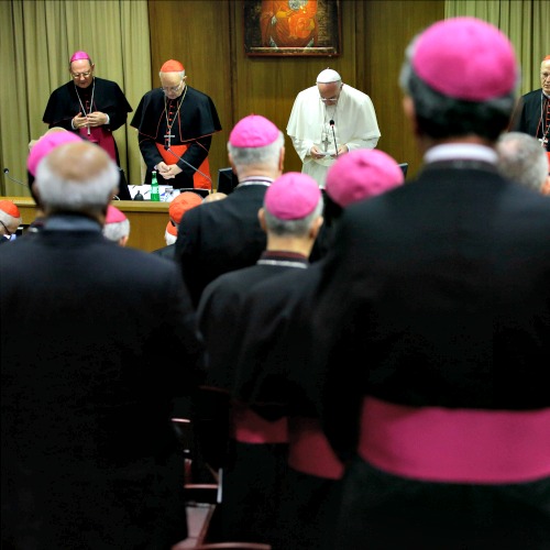 Pope Francis prays as he opens the morning session of the synod on the family Oct. 18 at the Vatican.

