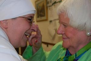 A Little Sister of the Poor banters with a resident of the Jeanne Jugan Home in Washington.