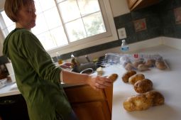 PREPARATIONS. Terry Angelotti prepares a simple, meatless Lenten dinner at her family's house in Centreville, Va., last year.