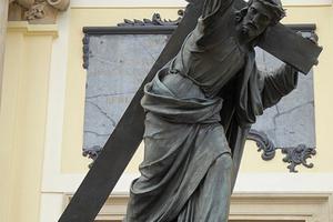 Statue of Christ carrying the cross at the front of the Holy Cross Church in Warsaw.