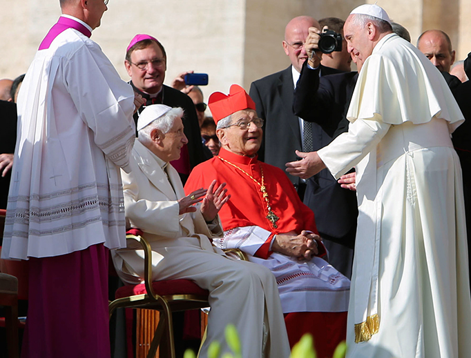 Pope Francis greets Pope Emeritus Benedict XVI in the Vatican during a meeting with the elderly Sept. 28, 2014.