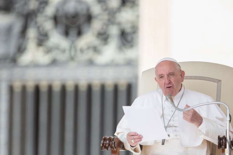 Pope Francis speaks at his general audience Sept. 18. 