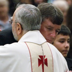 John Green hugs Bishop Gerald Kicanas of Tucson, Ariz., during the funeral Mass for his daughter, Christina Taylor Green, at St. Elizabeth Ann Seton Church in Tucson Jan. 13. Christina was killed in the Jan. 8 shootings that left six dead and 14 others wounded, including Rep. Gabrielle Giffords. 