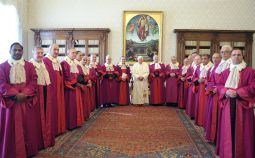 GETTING TOUGH? Pope Benedict XVI poses with judges of the Roman Rota, a court that primarily deals with appeals filed in marriage annulment cases, during an annual meeting at the Vatican Jan. 29. In a speech to the judges, the Pope said true pastoral charity and concern can never lead the Church to grant an annulment to a Catholic whose marriage is valid according to Church law. 
