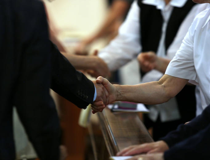 Participants exchange the Sign of Peace during a June 16 prayer service for victims of the Orlando massacre. (Alexey Gotovskiy/Catholic News Agency)