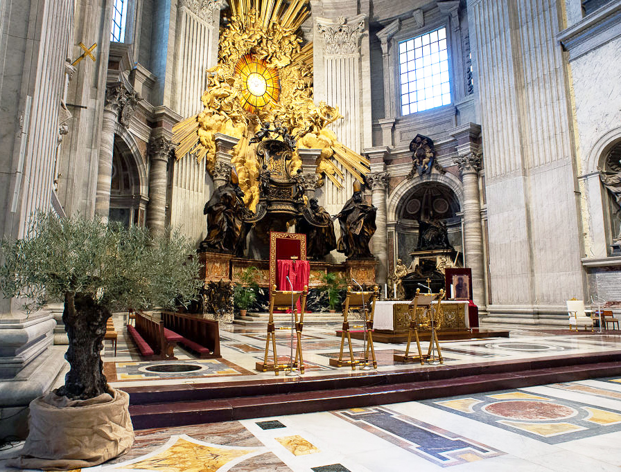 A view of the main altar of St. Peter's Basilica prepared for the Palm Sunday vigil on April 4, 2020, in Vatican City. Pope Francis will celebrate the Palm Sunday Mass in an empty basilica. Yesterday the Pontiff sent a video message as Christians around the world prepare to celebrate Holy Week in an unusual manner due to the COVID-19 coronavirus pandemic.