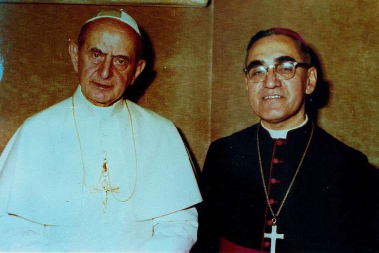 Pope Paul VI and Archbishop Oscar Romero pose together in an undated file photo. 