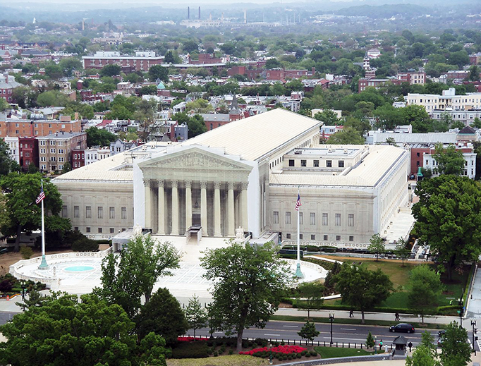 The Supreme Court Building of the United States from the dome of the capitol building. The facade is covered during renovation.
