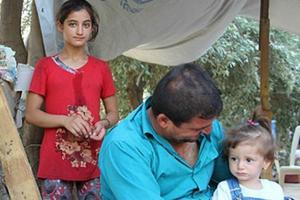 A family of Christian refugees in Iraq who are taking shelter at the Syriac Catholic Mrtshmony Shrine in Erbil. 