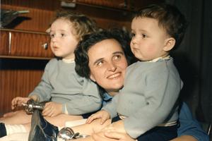 St. Gianna, living holy the present moment, with two of her children.