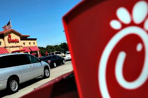 Drive-through customers wait in line at a Chick-fil-A restaurant in Fort Worth, Texas. 
