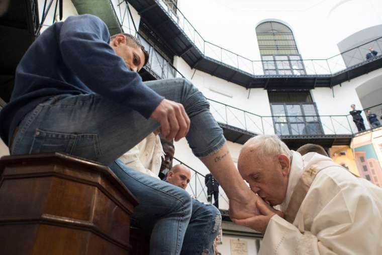 Pope Francis kisses a prisoner’s foot at Rome’s Regina Coeli Prison March 29. 