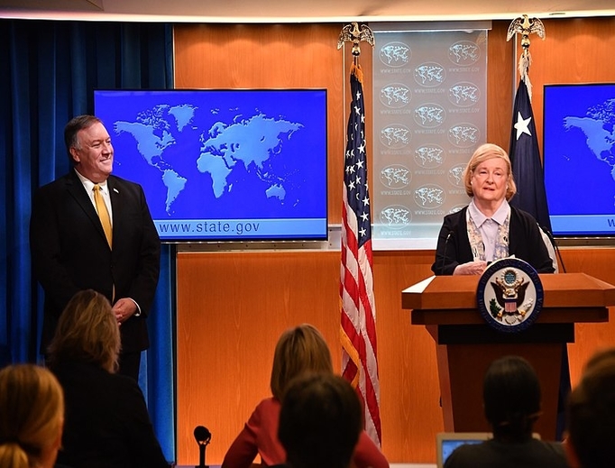 U.S. Secretary of State Michael Pompeo listens to the Chair of the Commission on Unalienable Rights, Mary Ann Glendon, as she delivers remarks to the press at the U.S. Department of State in Washington D.C., July 8, 2019.