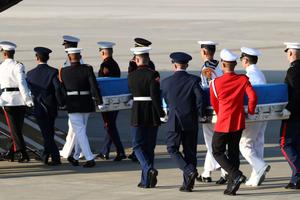 U.N. honor guards carry coffins containing the remains of U.S. soldiers who were killed in the Korean War during an Aug. 1 ceremony at Osan Air Base in Pyeongtaek, South Korea. North Korea returned the remains of some U.S. soldiers who died during the 1950-53 Korean War last week, following through on a promise North Korean leader Kim Jong Un made to U.S. President Donald Trump when the leaders met in Singapore June 12. 