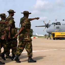 Nigerian troops board a C-130.