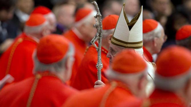 Pope Francis walks among cardinals on Feb. 14