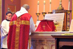 A priest faces 'ad orientem' during Mass in the chapel of the Cathedral of the Holy Cross in Boston.