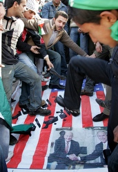 Protesters stomp on U.S flag during Dec. 29 anti-Israeli protest.