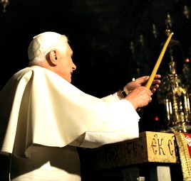 Pope Benedict XVI lights a candle in the Golgotha in the Church of the Holy Sepulcher in Jerusalem's Old City.