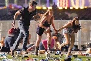 People run from the Route 91 Harvest country music festival after apparent gun fire was heard, Oct. 1 in Las Vegas, Nevada. A gunman has opened fire on a music festival in Las Vegas, leaving at least 50 people dead and more than 200 injured. Police have confirmed that one suspect has been shot. The investigation is ongoing.