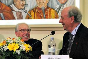 Cardinal Giovanni Re (l) listens as Guido Gusso discusses the 'papal voices archive' April 1 at Vatican Radio.