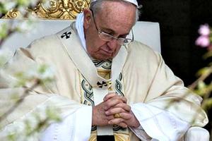 Pope Francis prays on Easter Sunday morning in St. Peter's Square on April 5.