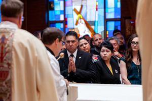 Above, John and Maria Castillo attend the funeral Mass for their son, Kendrick. Below, the Mass for the heroic young man included an honor guard of Knights of Columbus and touching eulogies, including from Bishop Jorge Rodriguez, auxiliary bishop of Denver. Also below, Maria Castillo and her son pose for a photo on a happy occasion.