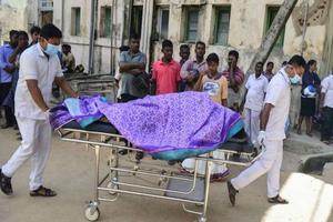 Sri Lankan hospital workers transport a body to a hospital morgue after several bomb blasts on Easter Sunday. 