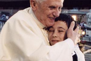Pope Benedict XVI hugs a boy during his weekly General Audience. 