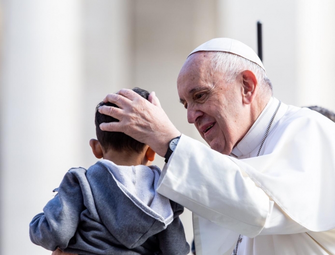 Pope Francis blesses a child during his Wednesday General Audience on May 1, 2019. 
